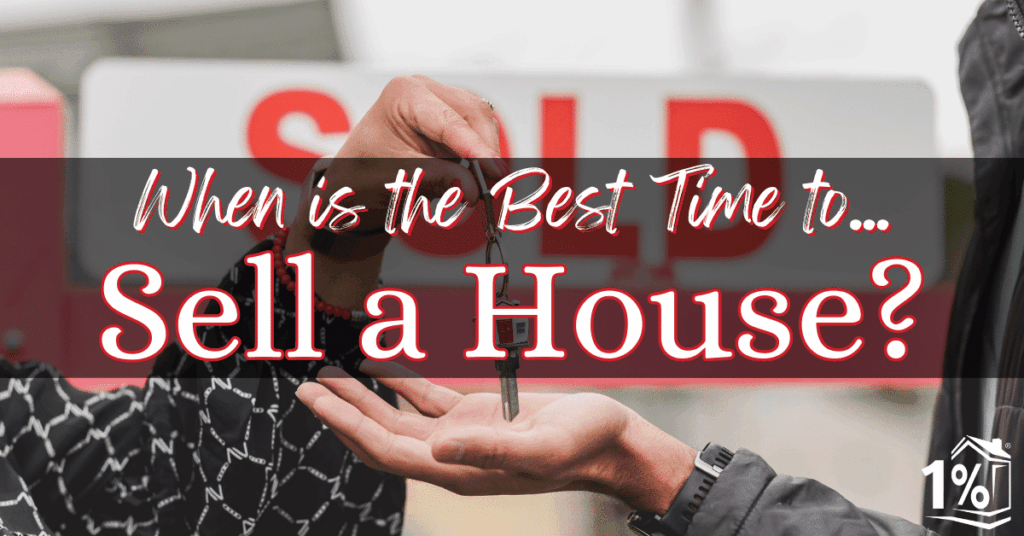 A Realtor handing keys to the owner of a recently sold home