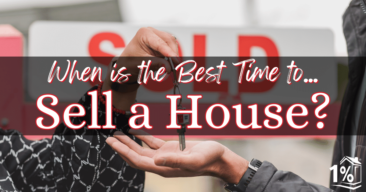 A Realtor handing keys to the owner of a recently sold home